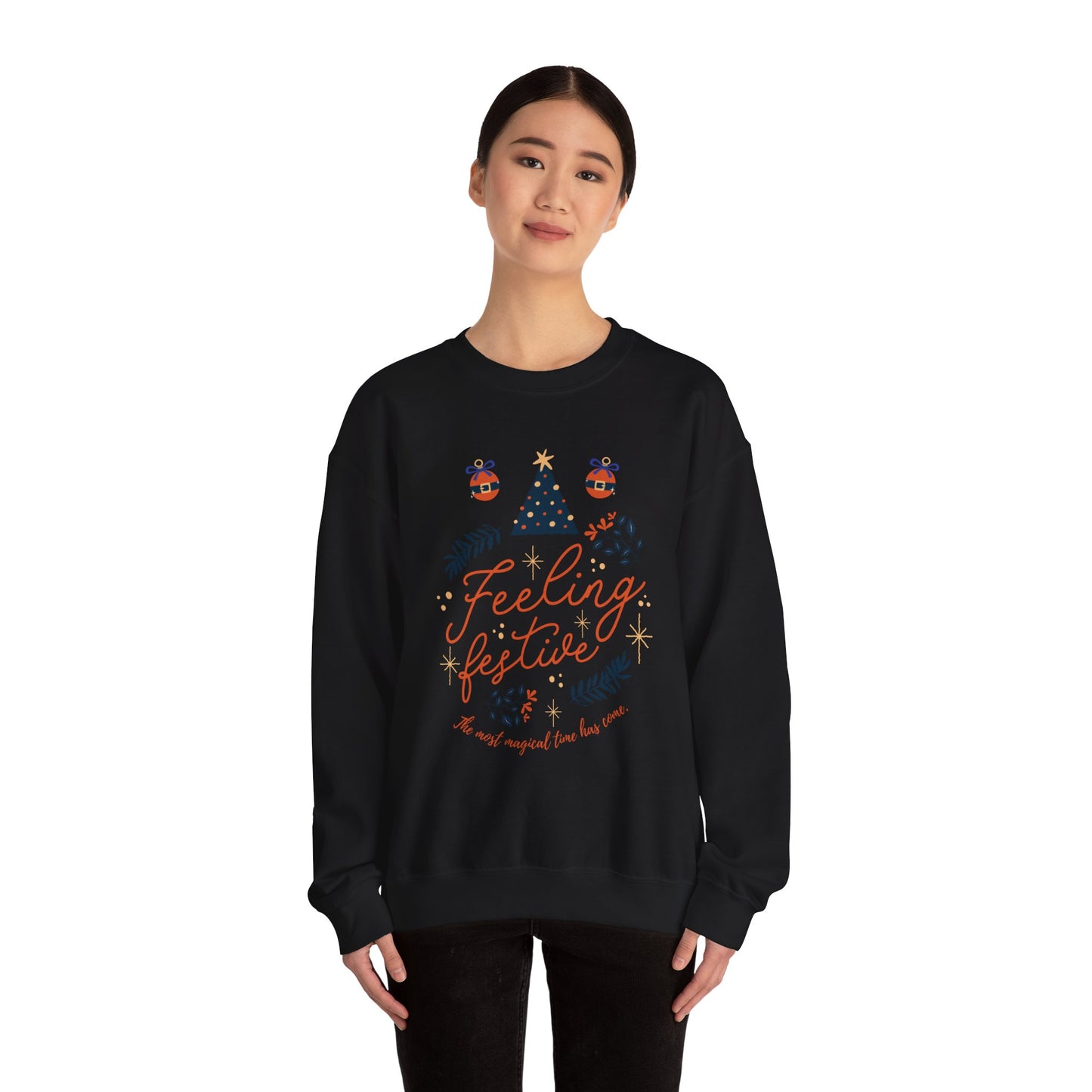 Woman wearing a black 'Feeling Festive' Christmas sweatshirt.