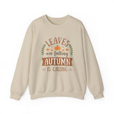 Beige crewneck sweatshirt with 'Leaves are falling, Autumn is calling' graphic.