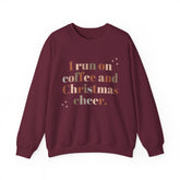 Burgundy sweatshirt with 'I run on coffee and Christmas cheer' graphic.