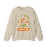 Beige sweatshirt with 'I think I love fall most of all' graphic.