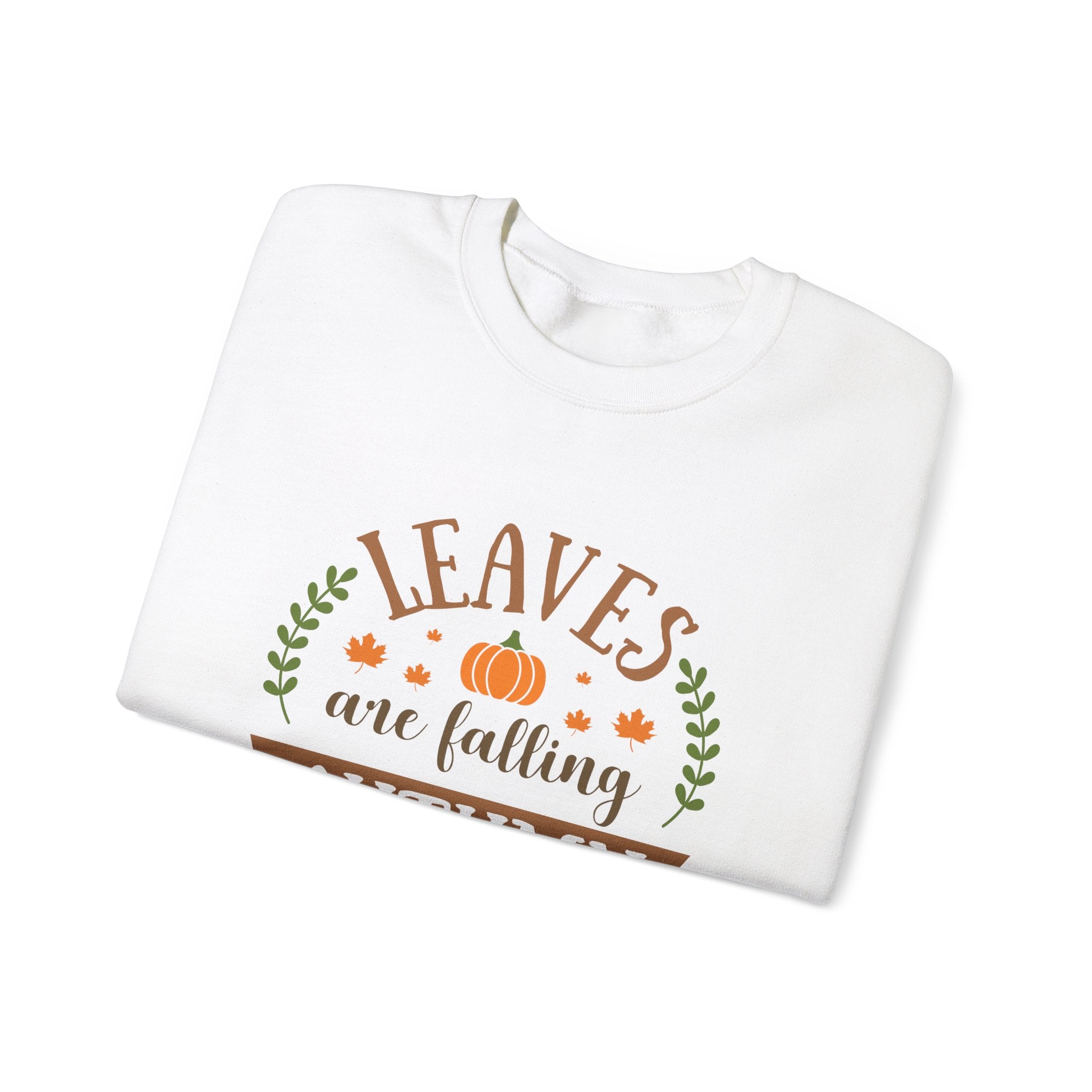 White sweatshirt with 'Leaves are Falling' text, pumpkin and leaf graphics.