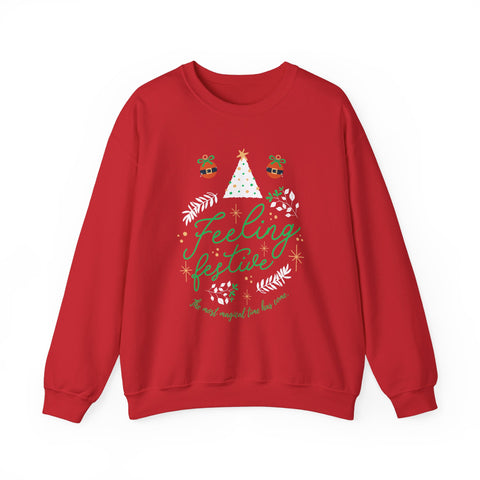 Red 'Feeling Festive' Christmas sweater with tree and ornament graphics.