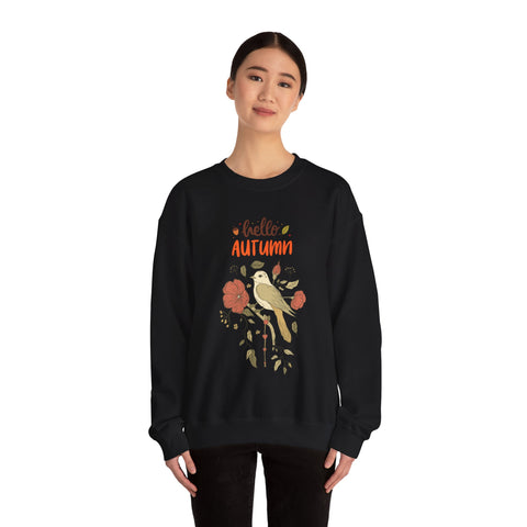 Woman wearing a black 'Hello Autumn' sweatshirt with bird and floral design.