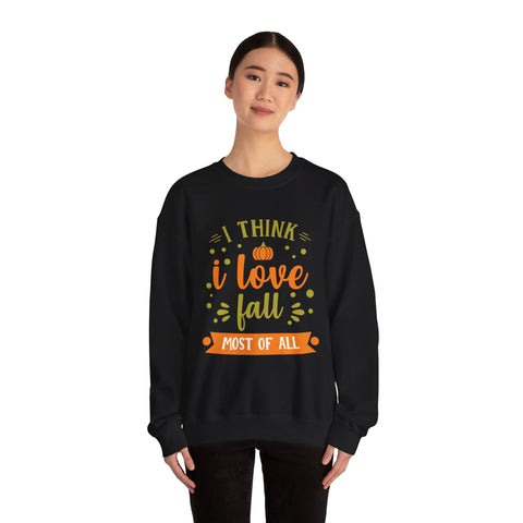 Woman wearing black sweatshirt with 'I think I love fall most of all' graphic.