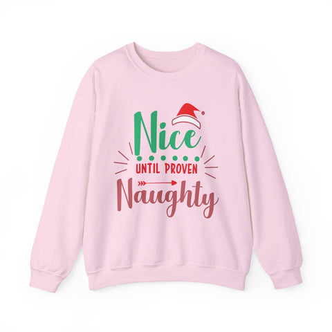 Pink sweatshirt with 'Nice Until Proven Naughty' graphic for Christmas. Festive apparel.