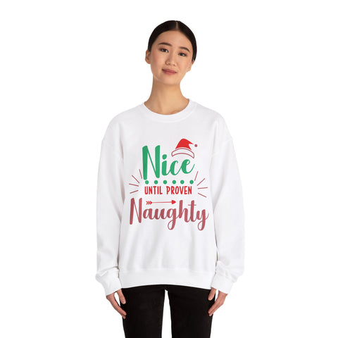 Woman in white 'Nice Until Proven Naughty' Christmas sweatshirt.