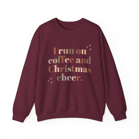 Burgundy sweatshirt with 'I run on coffee and Christmas cheer' graphic.