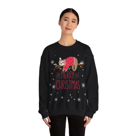 Woman wearing a black 'Merry Christmas' sweatshirt with a sloth wearing a sweater on a branch with lights.