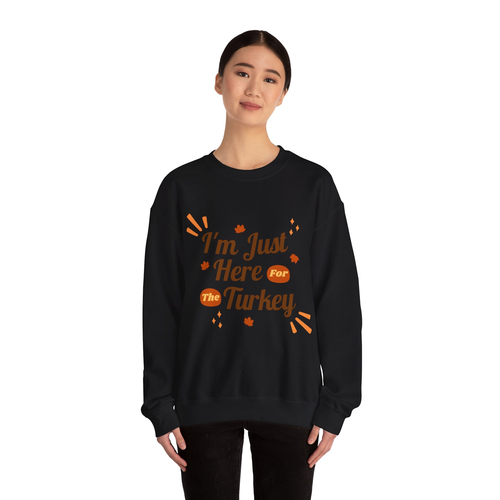 Woman in black 'I'm Just Here for the Turkey' Thanksgiving sweatshirt.
