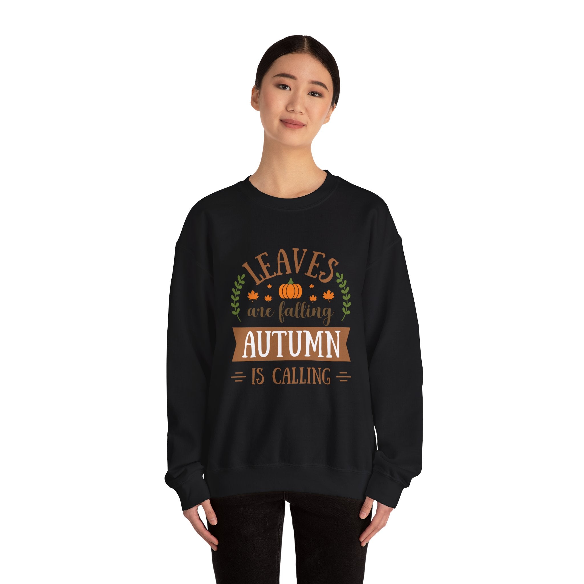 Black sweatshirt featuring 'Leaves are falling, Autumn is calling' design. Fall fashion.