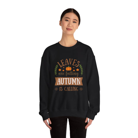 Black sweatshirt featuring 'Leaves are falling, Autumn is calling' design. Fall fashion.