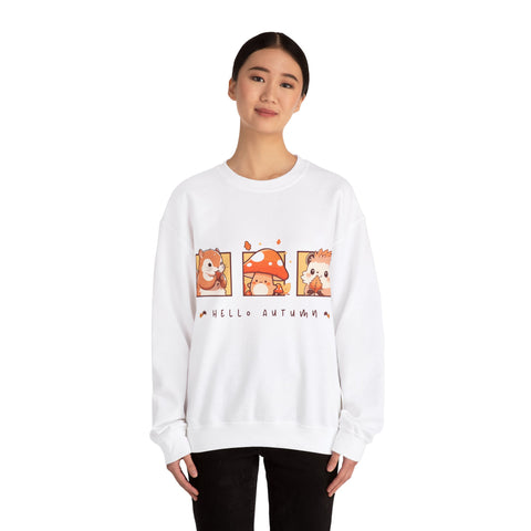 White sweatshirt featuring a 'Hello Autumn' design with squirrel, mushroom, and hedgehog cartoons.
