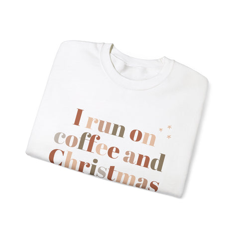 White sweatshirt with 'I run on coffee and Christmas' text, holiday apparel.
