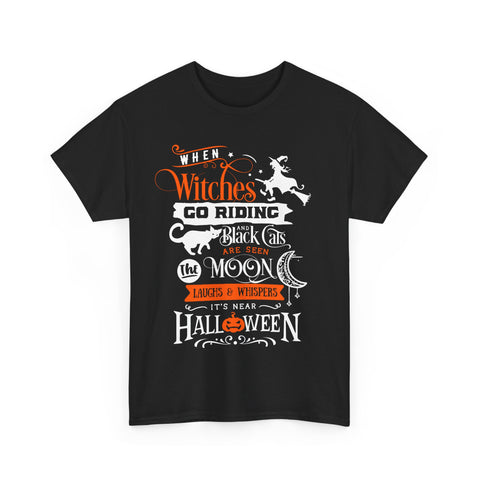 Black Halloween T-shirt with 'When Witches Go Riding...' graphic featuring a witch, cat, moon, and pumpkin.