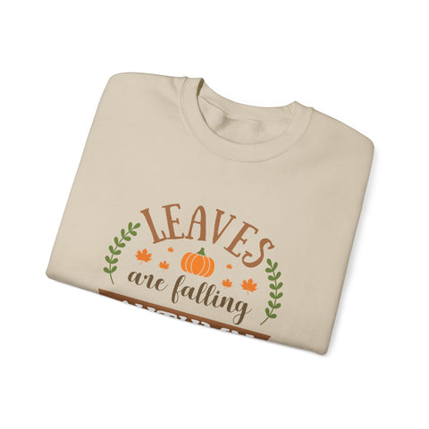 Beige sweatshirt with 'Leaves are falling' graphic featuring a pumpkin and fall leaves.