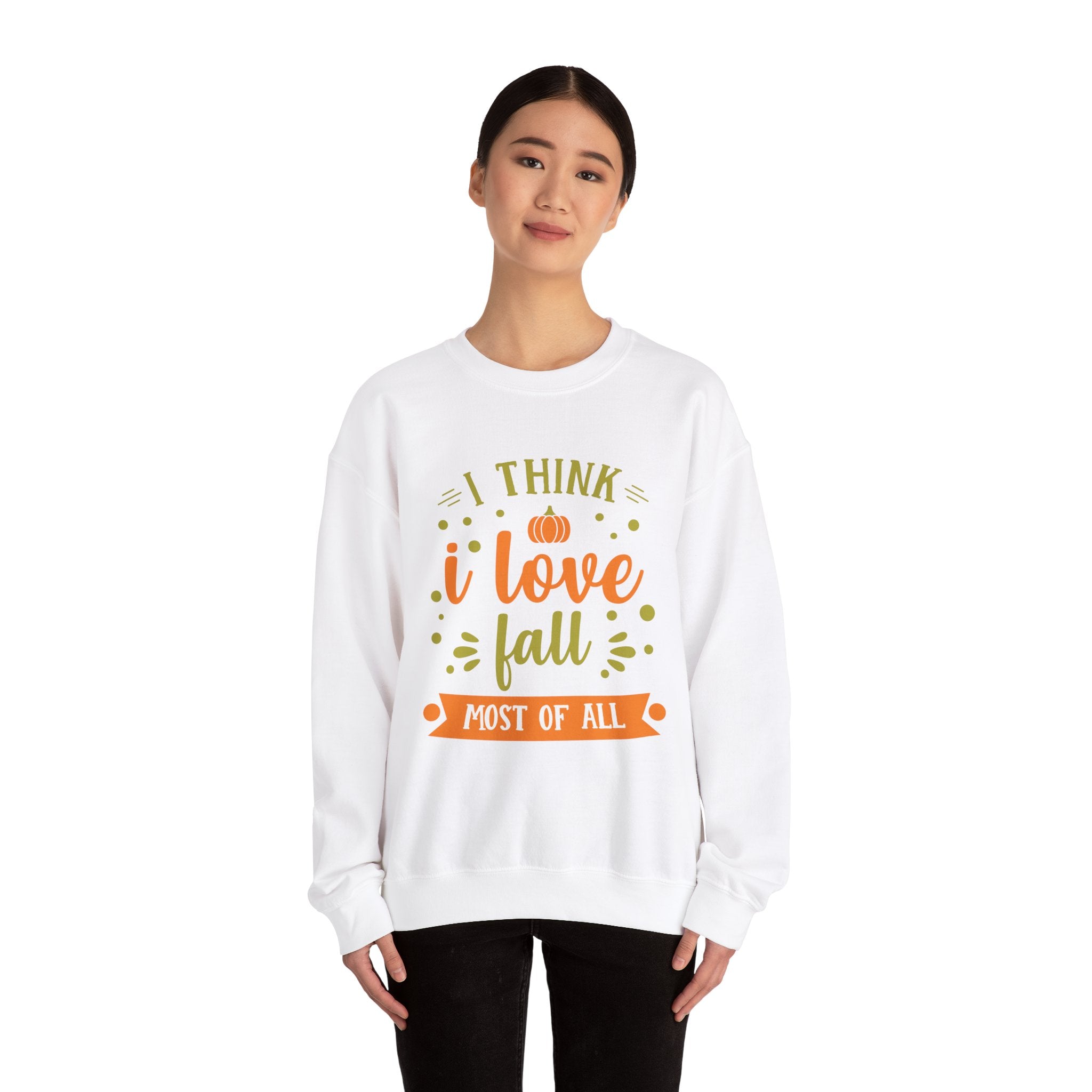Woman wearing a white 'I love Fall' sweatshirt with pumpkin graphic, perfect for autumn.