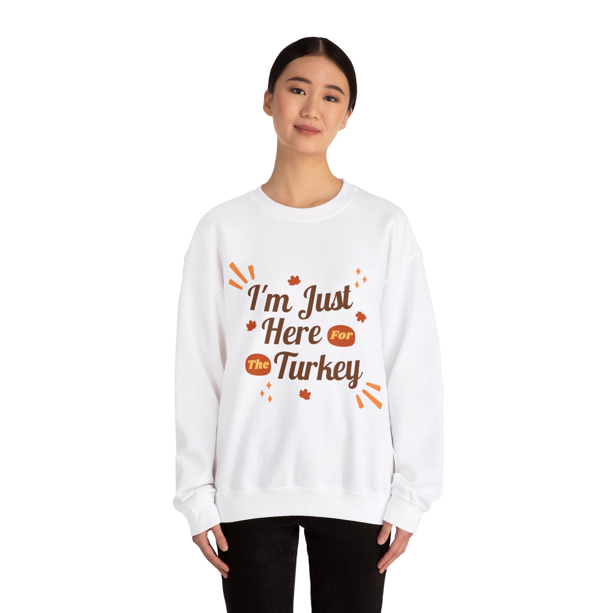 Woman wearing a white 'I'm Just Here For The Turkey' Thanksgiving sweatshirt.